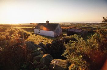 Traditional Cottage in Sunset